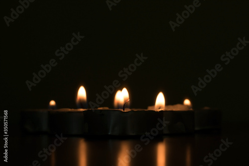 A small candle or light in the dark
