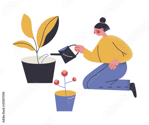 Girl watering home plants and staying at home during coronavirus pandemic