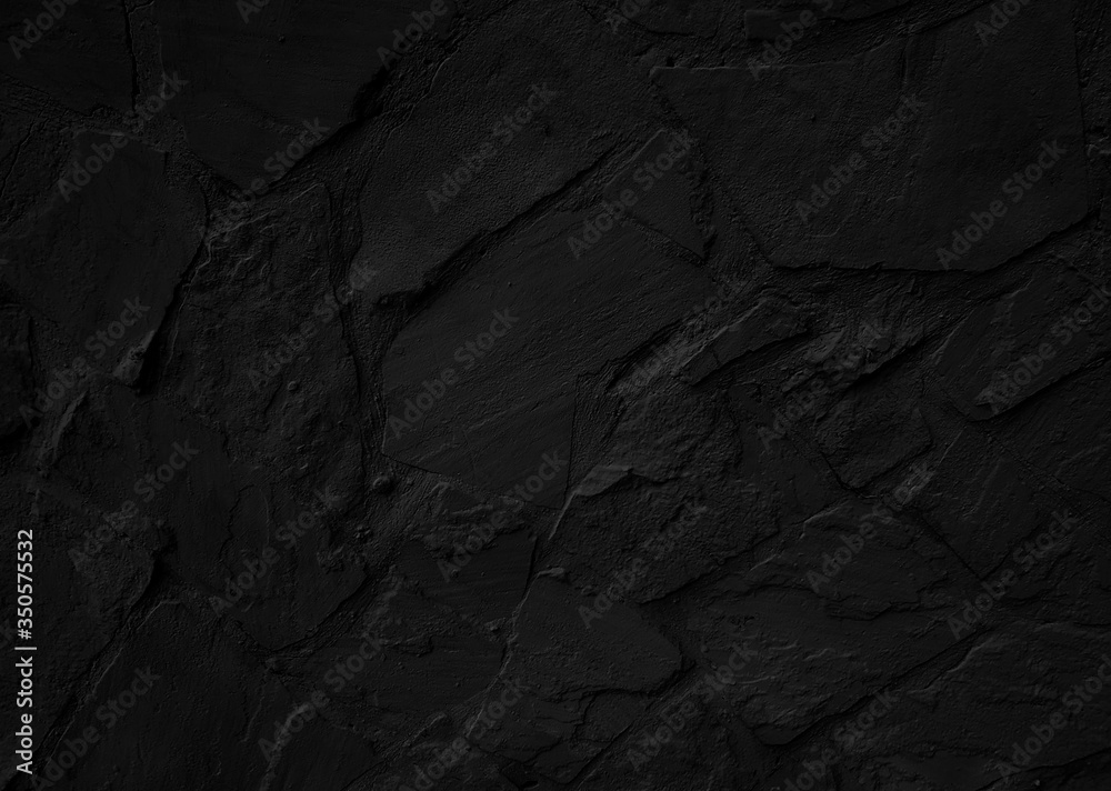Black stone textured wall. Grunge background Black stone textured wall. Grunge background