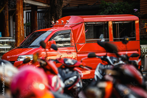 Fototapeta Naklejka Na Ścianę i Meble -  red bus, red taxi, transport in thailand
