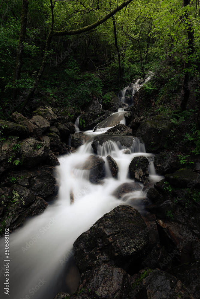 Little waterfall (named Irusta) surronded by the forest of Aiako Harriak mountain at Basque Country.	