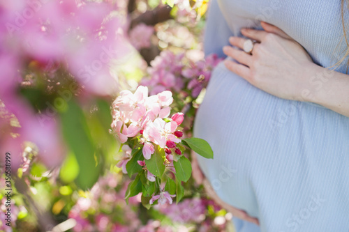 pregnant belly with pink flowers