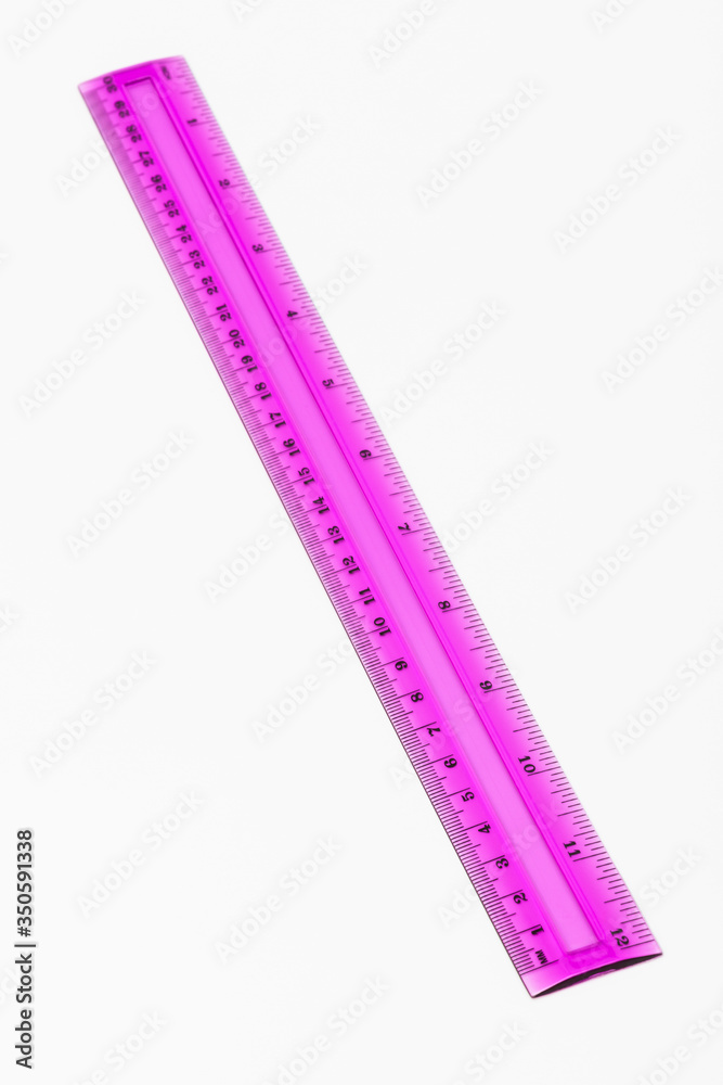 plastic pink ruler on white background plastic pink ruler on white background