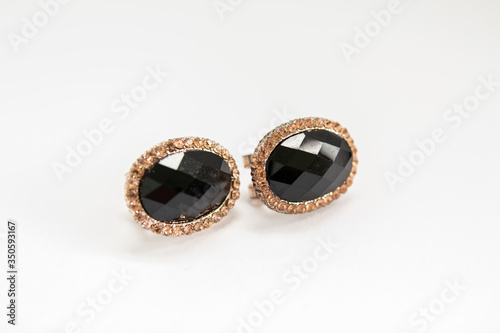 gold earrings with black stone