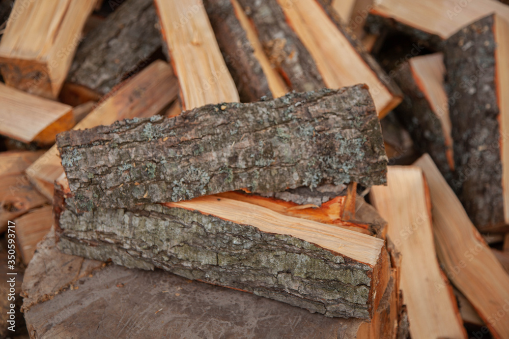 Trees in the sawmill are stacked in bags for sell. Stacks of firewood. Preparation of firewood for the winter. A heap of woodpile. Chopped wood. Firewood.Pile of wood logs ready for winter
Trees in the sawmill are stacked in bags for sell. Stacks of firewood. Preparation of firewood for the winter. A heap of woodpile. Chopped wood. Firewood.Pile of wood logs ready for winter