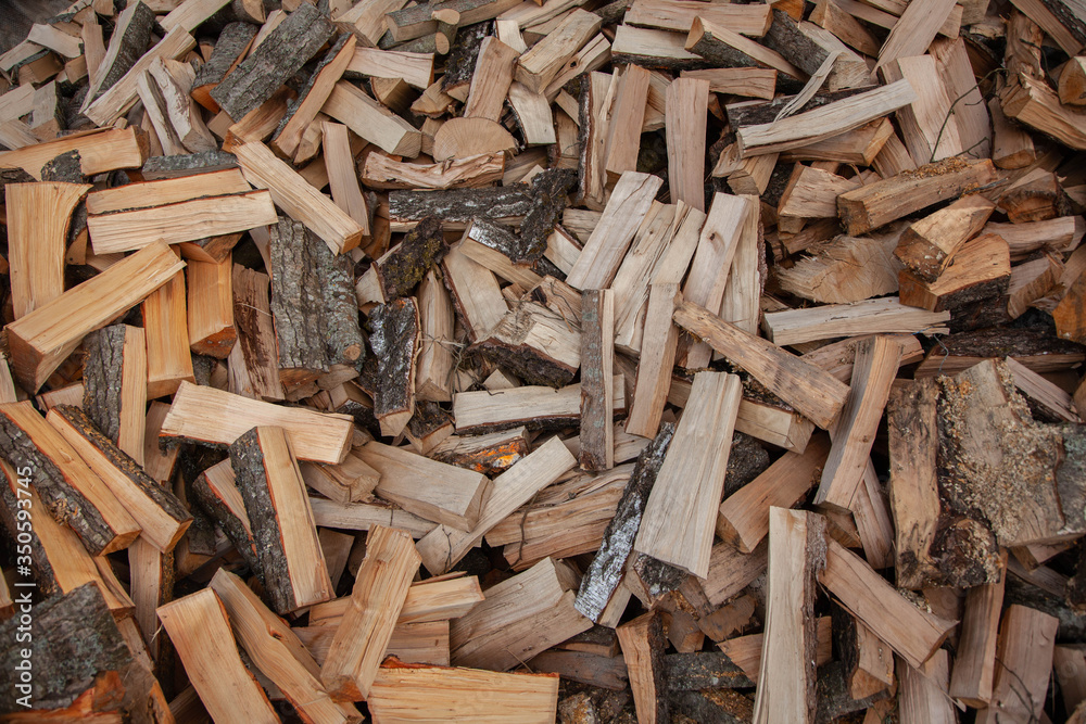 Trees in the sawmill are stacked in bags for sell. Stacks of firewood. Preparation of firewood for the winter. A heap of woodpile. Chopped wood. Firewood.Pile of wood logs ready for winter
Trees in the sawmill are stacked in bags for sell. Stacks of firewood. Preparation of firewood for the winter. A heap of woodpile. Chopped wood. Firewood.Pile of wood logs ready for winter