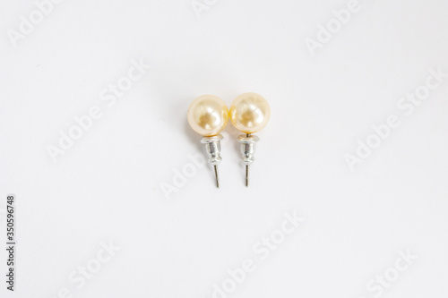 earrings with pearls on a white background