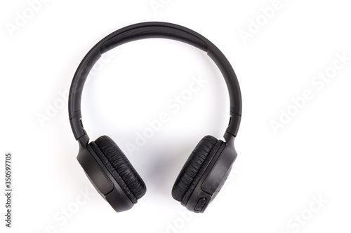 Black wireless headphones on white background. Advanced acoustic stereo sound system