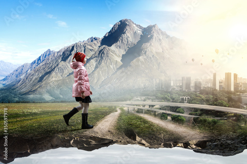 Little girl walking a landscape