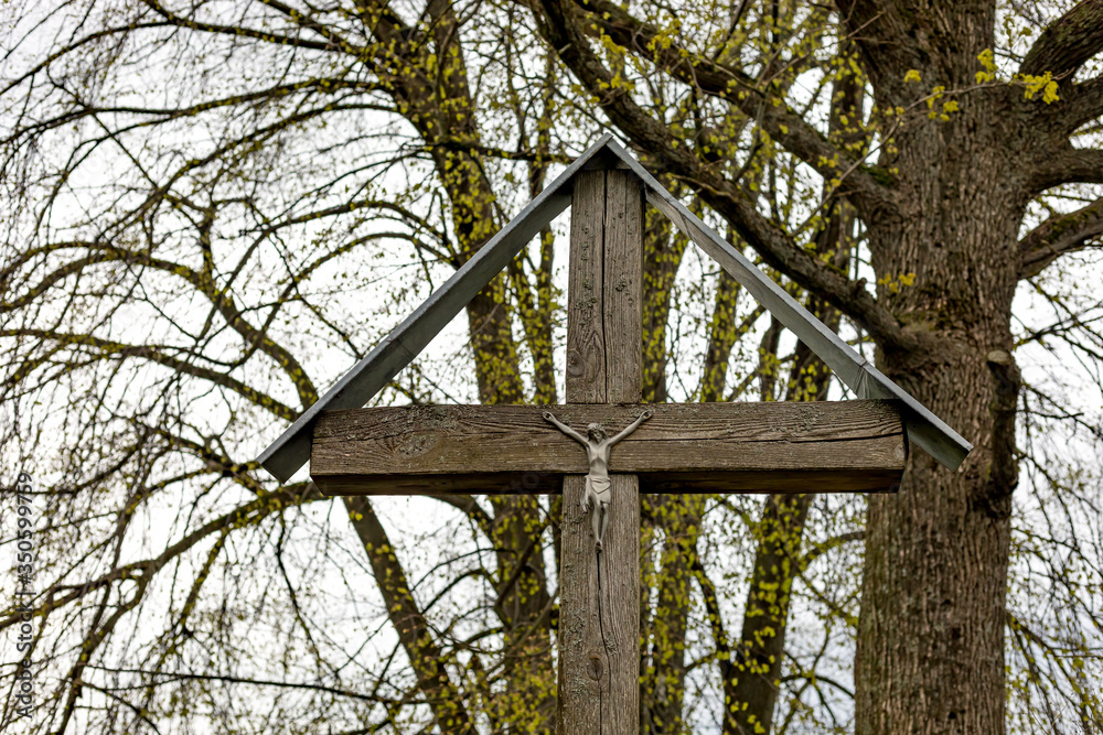 wooden cross with crucified Jesus
