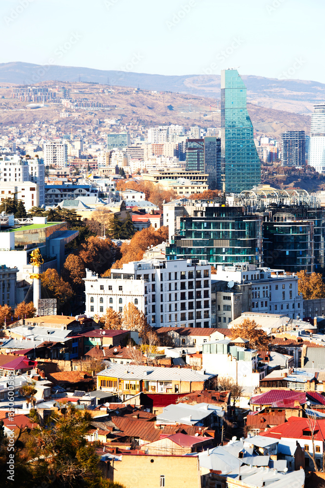 Obraz premium TBILISI, GEORGIA December 17, 2019: Beautiful aerial view of the old part of city with modern buildings in Tbilisi, Georgia