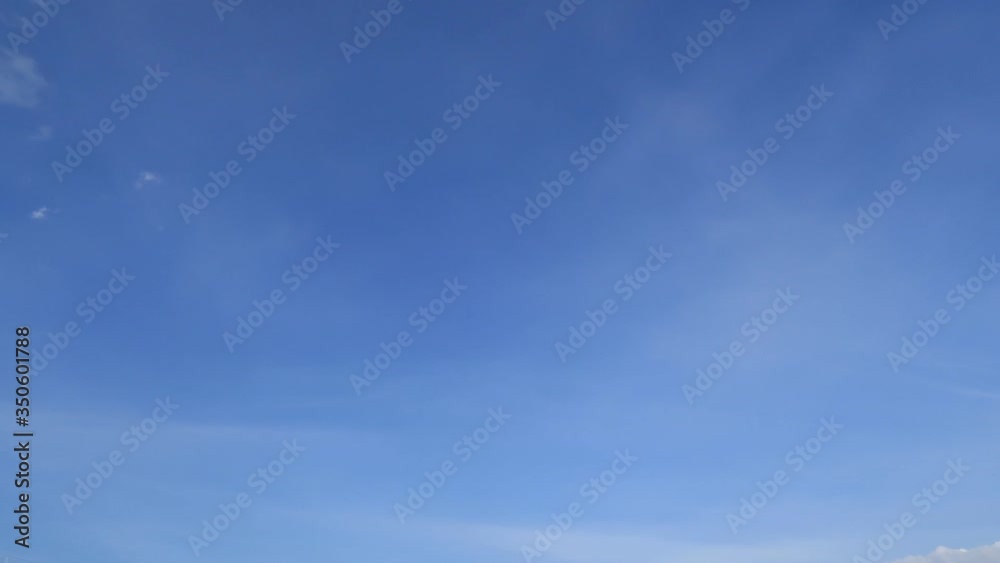 Wispy smoke clouds on sunny blue sky background with cirrus & cirrostratus cloudscape slowly moved above daylight horizon in tropical summer or spring morning sunlight, Beautiful natural TimeLapse Wispy smoke clouds on sunny blue sky background with cirrus & cirrostratus cloudscape slowly moved above daylight horizon in tropical summer or spring morning sunlight, Beautiful natural TimeLapse