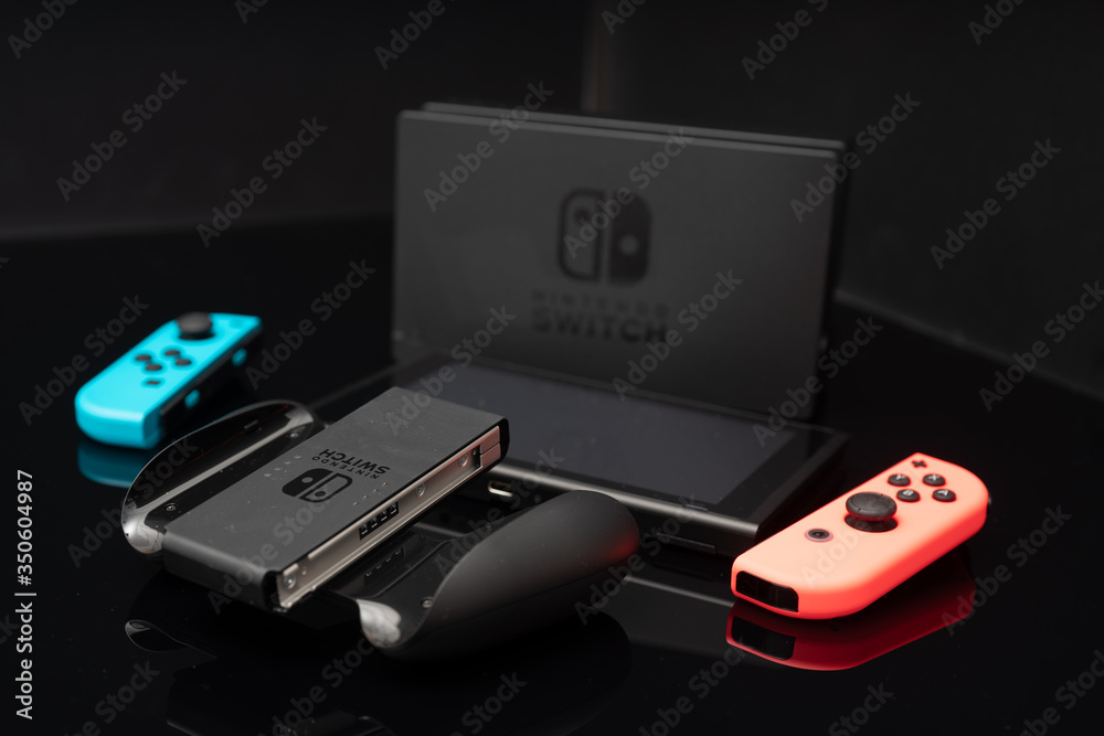 Nintendo Switch video game console developed by Nintendo, released on March  3, 2017 on a black background. Germany, Berlin - June 30, 2019: Nintendo  Switch Joy-con controller on a white background Stock-Foto | Adobe Stock