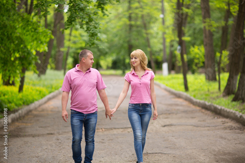 beautiful couple walks in the park © Наталия Раздорская