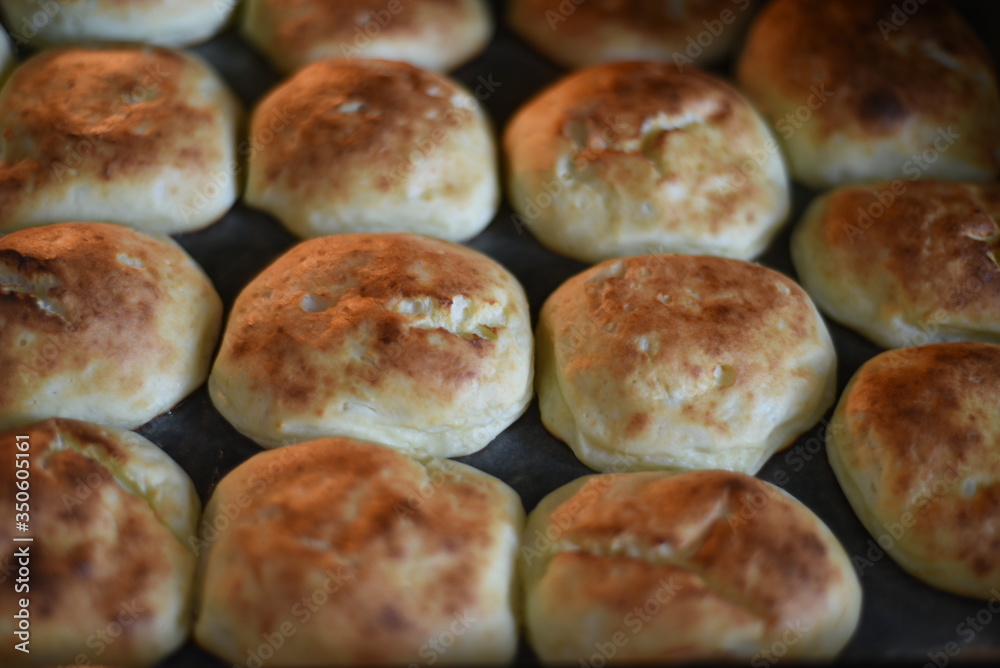 Rosy and cracked buns have just been taken out of the oven. Delicious! Rosy and cracked buns have just been taken out of the oven. Delicious!