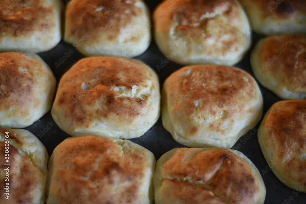 Rosy and cracked buns have just been taken out of the oven. Delicious! Rosy and cracked buns have just been taken out of the oven. Delicious!