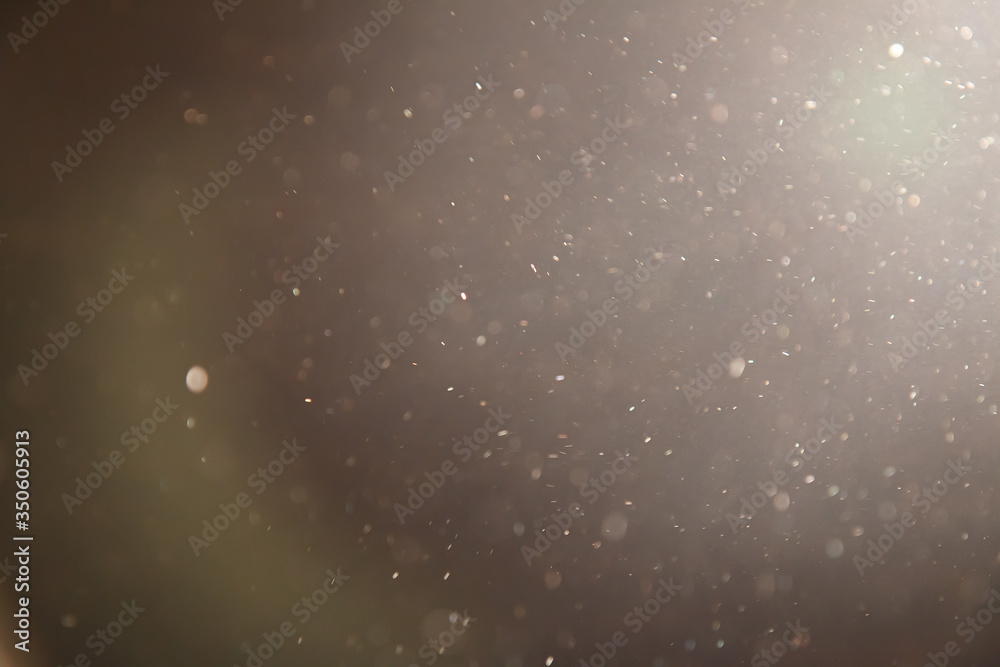 golden colour dust particle on black background