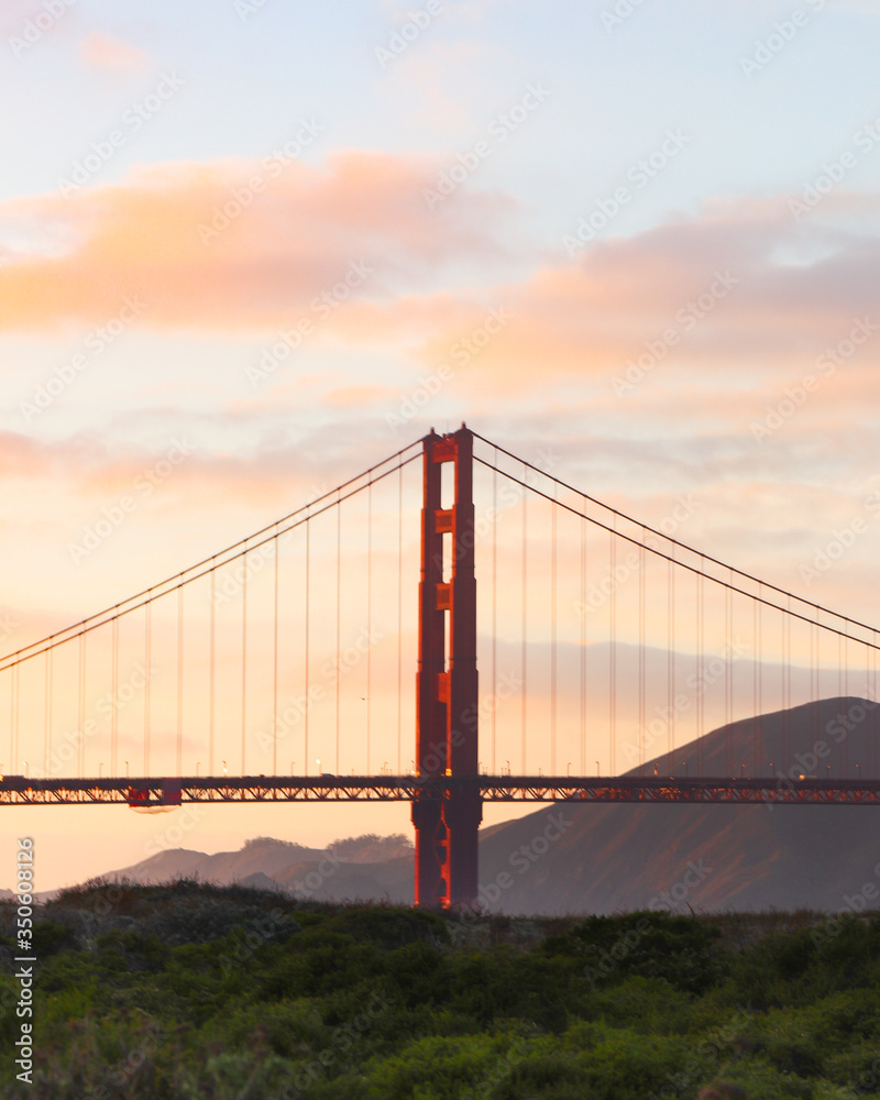 San Francisco Golden Gate Bridge at sunset, Clear view with pink and blue hues in the skies and clouds