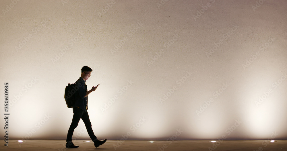 Fototapeta premium silhouette of man use phone
