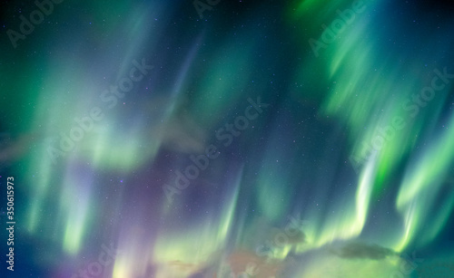 Aurora borealis, Northern lights swirl with star in the night sky