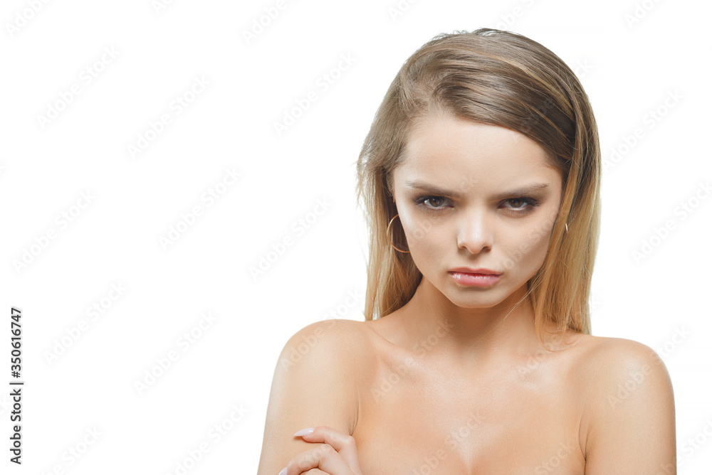A girl with an offended expression on a white background. A girl with an offended expression on a white background.