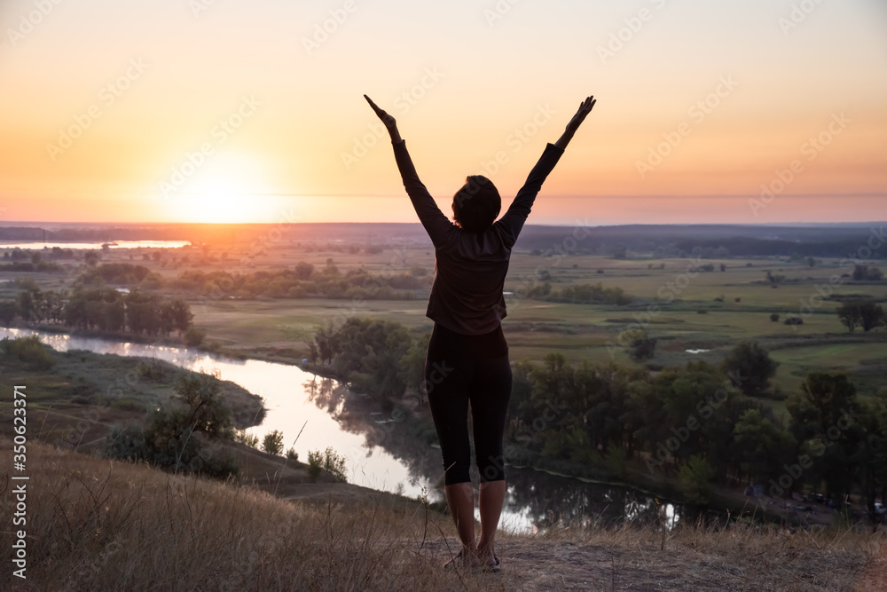 Meditation in sunrise summer field. Relax health concept Meditation in sunrise summer field. Relax health concept