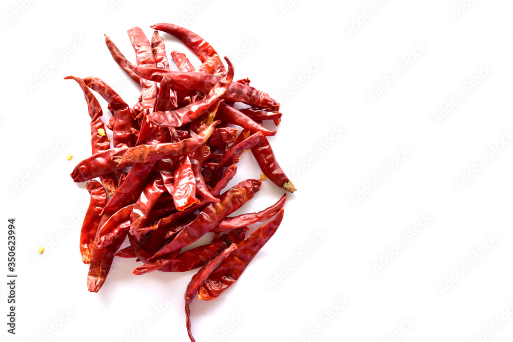 Obraz premium Dried red chillies on a white background