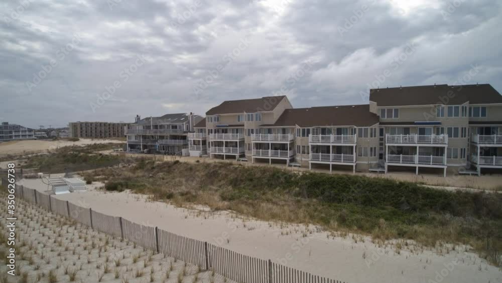 Above flying over residential of a American small town from on the ocean shoreline Seaside Heights Bay NJ US