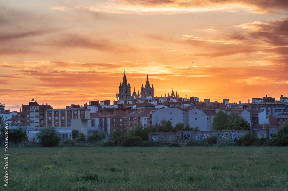 Sunset in the city of Leon, Spain, with a spectacular sky and in the center its fantastic gothic cathedral
