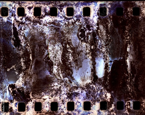 Fotografie Photographic film reel. Deteriorated. Color.