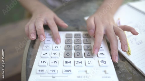 female using calculator for business