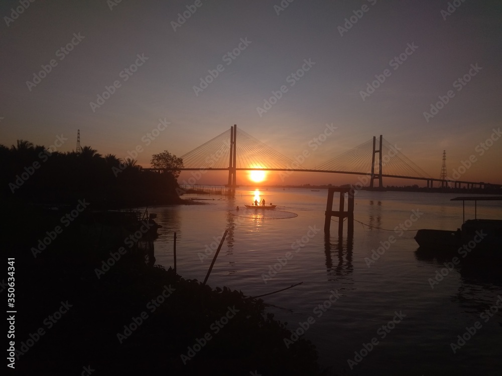 Fototapeta premium sunset over the river