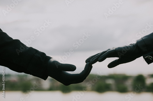 couple in black latex medical gloves