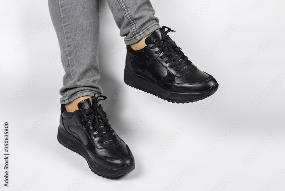 Black women's leather waterproof shoes for spring or autumn on women's feet