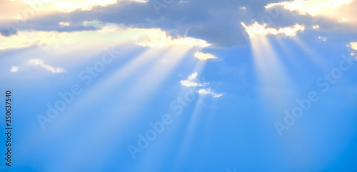 Photography The sun's rays break through the blue clouds