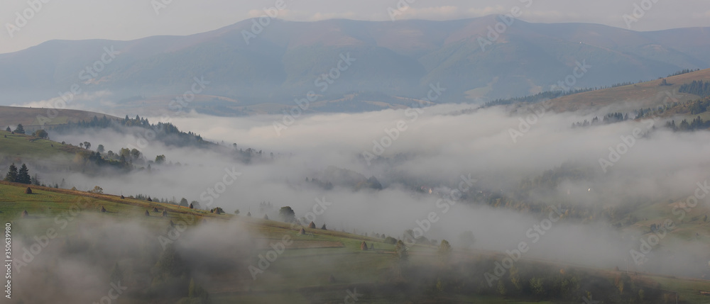 morning fog. mountain valley in the morning haze.