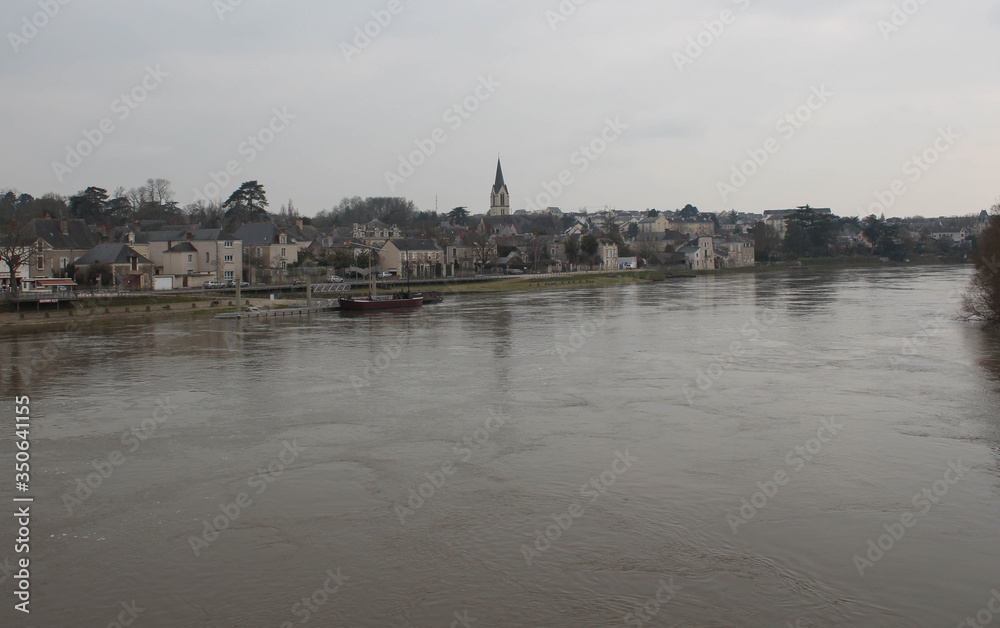 Fototapeta premium Village next to a river in France during winter