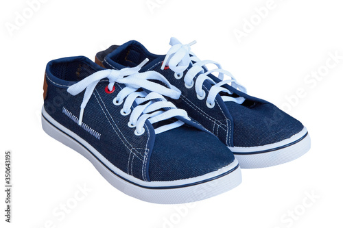plimsole isolated,pair of denim sneakers on a white background