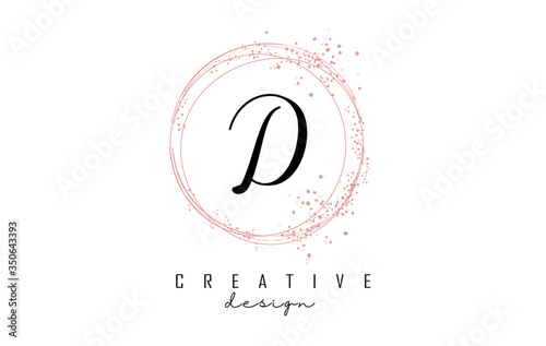 Sparkling circles and dust pink glitter frame for handwritten D letter logo.