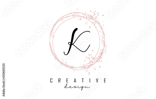 Sparkling circles and dust pink glitter frame for handwritten K letter logo.