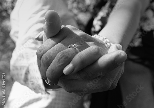 Canvastavla Intertwined hands of wedding couple with engagement ring as main object