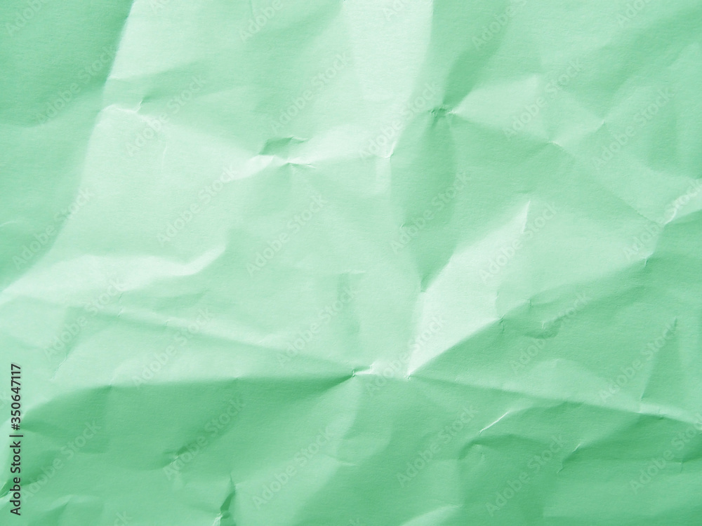 Obraz premium Mint green crumpled paper texture background