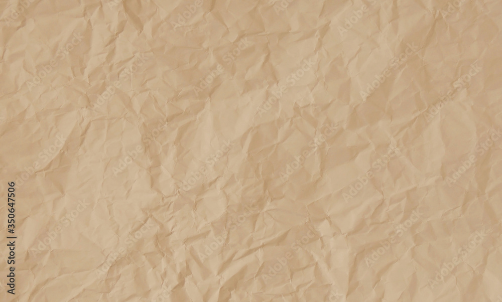 Crumpled pastel peach paper texture background Crumpled pastel peach paper texture background