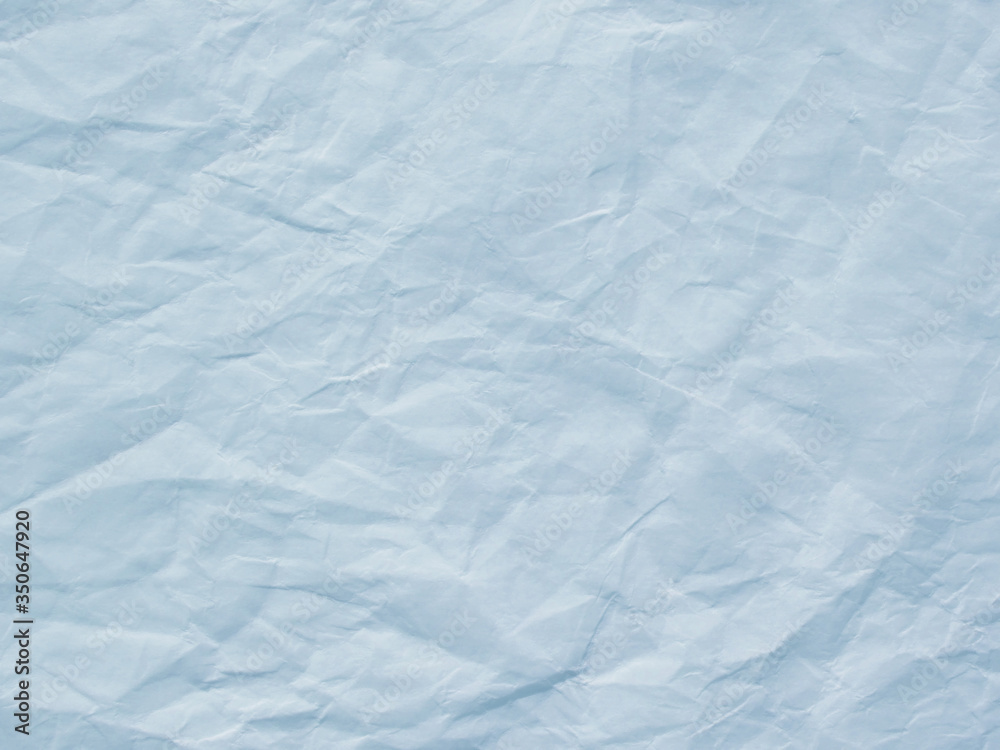 Obraz premium Light blue crumpled paper texture background