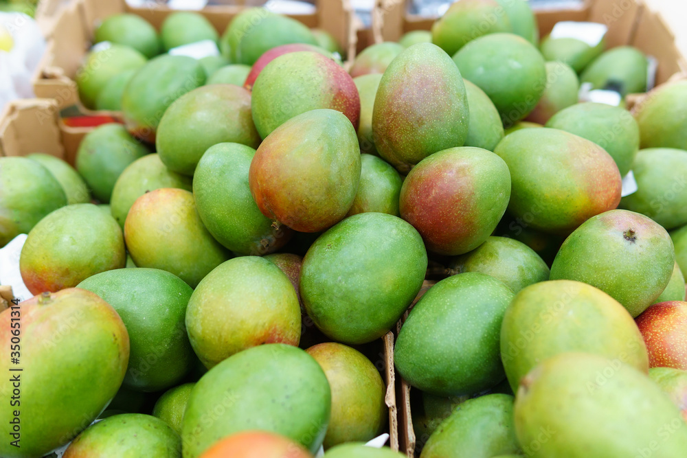 green mango fruit on the shelves. Colorful food, healthy lifestyle. green mango fruit on the shelves. Colorful food, healthy lifestyle.