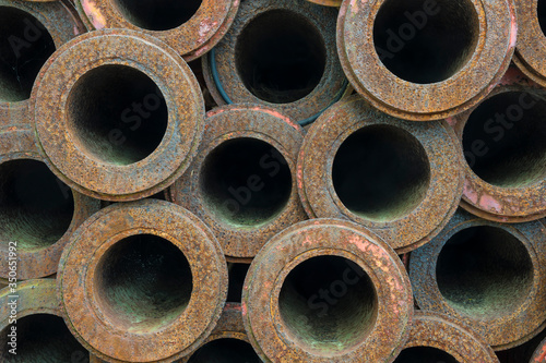 stack of old rusty pipes