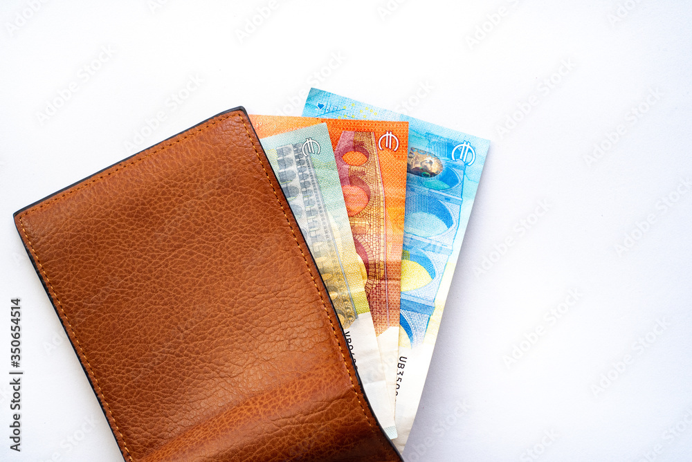 New wallet with money on a white background. European Banknotes in a open wallet. Stock Photo