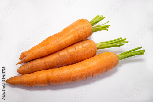Close up view of whole pieces of carrots isolated on a white background. No people