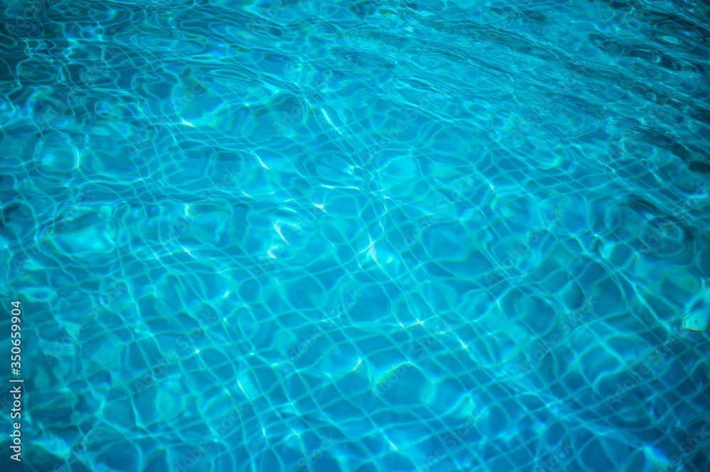 Clear refreshing blue swimming pool water texture