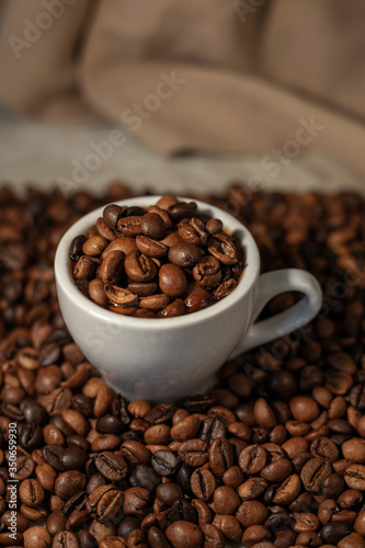 Fragrant coffee beans. Coffee in a cup. Fragrant drink.